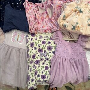 Assorted Girls' Dresses in Pastel and Floral Patterns